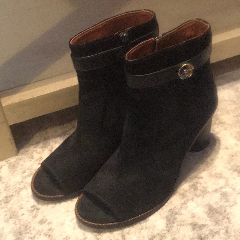 Black peephole Coach booties with zip up sides.